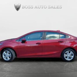 A 2018 Chevrolet Cruze LT Turbo sedan in red is parked on a gray surface, viewed from the side. The plain background shows the Boss Auto Sales logo and text at the top center.