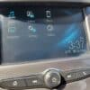 The infotainment screen of the 2018 Chevrolet Cruze LT Turbo displays icons for Audio, Gallery, Phone, Projection, Settings, and OnStar. The bottom right shows the time 3:37, date 08/23/2022, and a temperature of 31°C. Below are control buttons and a dial.