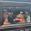 The 2018 Hyundai Elantra Limiteds infotainment screen displays 99.9 FM playing Top 40 on August 3 at 9:47 AM, with menu icons and a prompt to connect via Apple CarPlay or Android Auto.