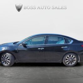 A black 2016 Nissan Altima 2.5 SV sedan is parked indoors on a gray floor, seen from the side, with the Boss Auto Sales logo above against a plain light background.