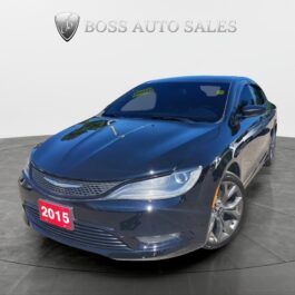 A 2015 Chrysler 200 S AWD Sedan in dark blue, featuring alloy wheels and tinted windows, is displayed in a showroom with 