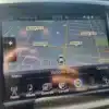 The 2015 Chrysler 200 S AWDs GPS screen centers on Simcoe St N, between Taunton Rd E and Largo Cres, offering convenient access to radio, media, controls, climate, phone, and settings. The current time is displayed as 10:33.