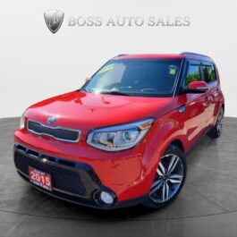 A 2015 Kia Soul SX Luxury is displayed in a studio with the Boss Auto Sales logo behind it, positioned to show its sleek front and side profile.