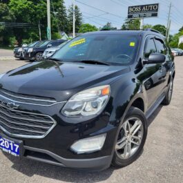 A 2017 Chevrolet Equinox 2LT AWD in black is parked at Boss Auto dealership on a sunny day, with other vehicles visible in the background.