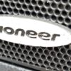 Close-up of a metal mesh speaker grille with the Pioneer logo on an oval silver badge, inside the 2017 Chevrolet Equinox 2LT AWD.
