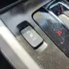 A close-up of the 2015 Honda Accord Touring V6 interior highlights the seat heater switch marked HI and LO with an illuminated indicator. Nearby, letters P and R are visible on a polished gear shift area.