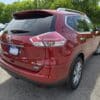 A 2015 Nissan Rogue 2.5 SL AWD with Loaded plates is parked in a lot on a sunny day, surrounded by trees and other vehicles.