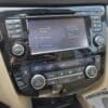 Dashboard of a 2015 Nissan Rogue 2.5 SL AWD shown with SiriusXM infotainment, climate control set to 18°C, audio/navigation/AC buttons, beige interior, and an APPRECIATED! floor mat visible.