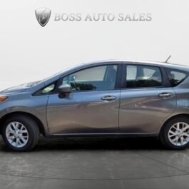 A gray 2017 Nissan Versa Note SV is shown from the side, parked indoors on a circular platform with Boss Auto Sales displayed on the light background above.