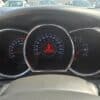 Close-up of a 2013 Kia Optima EX dashboard displays the speedometer, tachometer, and fuel gauge. The center digital screen shows a red Door Open icon, temperature at 20°C, and an odometer reading of 80,171 km.