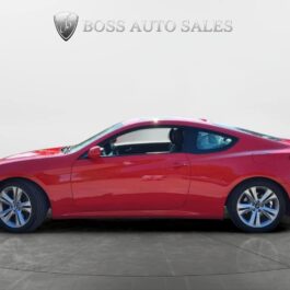 A red two-door coupe car parked on a gray surface, viewed from the side, with “Boss Auto Sales” logo and name displayed on a plain white background above the car.