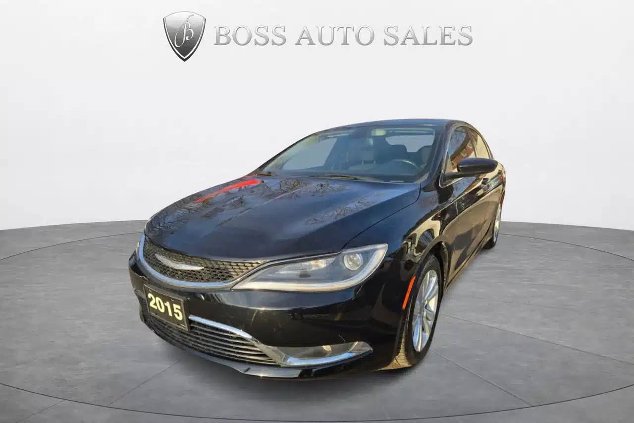 A black 2015 Chrysler 200 Limited sedan is displayed in a circular showroom with the Boss Auto Sales logo overhead and a neutral background, highlighting the sleek design of the 2015 Chrysler 200 Limited.