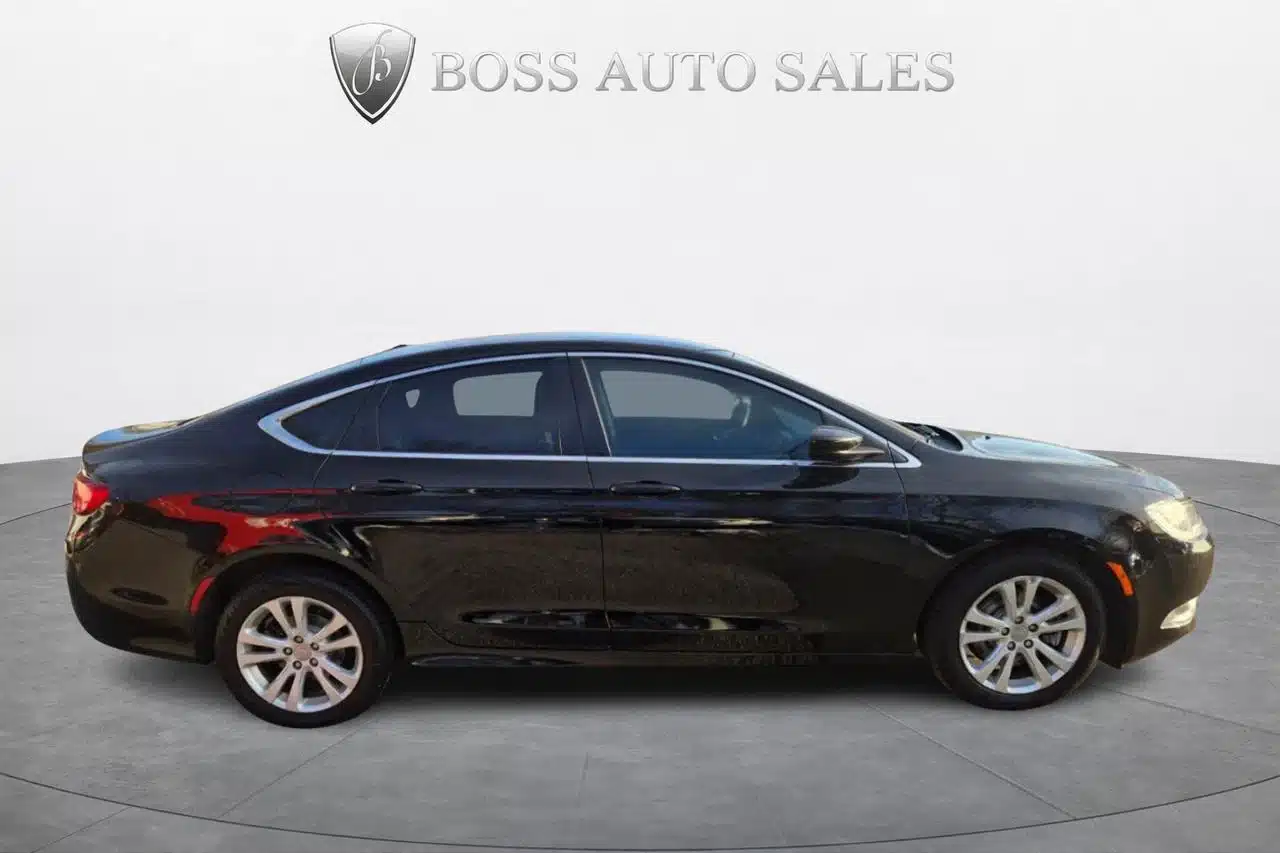 A 2015 Chrysler 200 Limited in black, shown in a profile view while parked on a circular platform, with the Boss Auto Sales logo and text displayed above.
