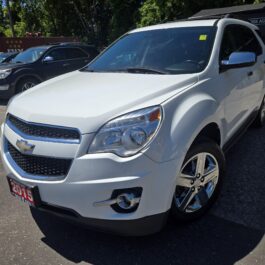 A 2015 Chevrolet Equinox 2LT AWD is parked outdoors in a car lot on a sunny day, surrounded by other vehicles and trees. A 2015 Chevrolet Equinox 2LT AWD is parked outdoors in a car lot on a sunny day, surrounded by other vehicles and trees.