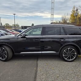Side profile of a 2020 Lincoln Aviator Reserve AWD parked in a lot.